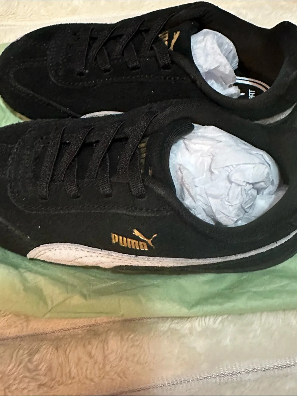 Puma Black Suede Sneakers with Gold Logo and White Accent